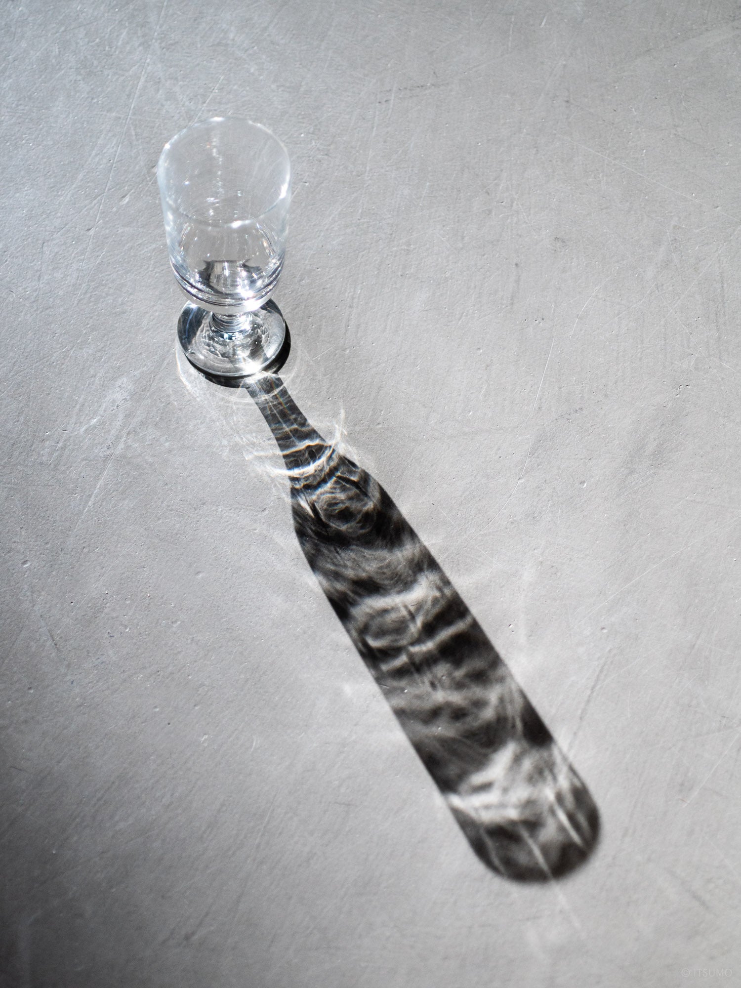 Azmaya handblown Stem Glass producing a long decorative shadow