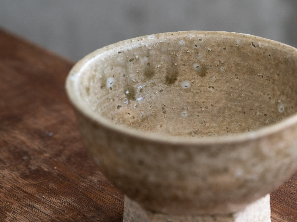 Small iga ware ceramic bowl with hexagon base and textured earth tone glaze