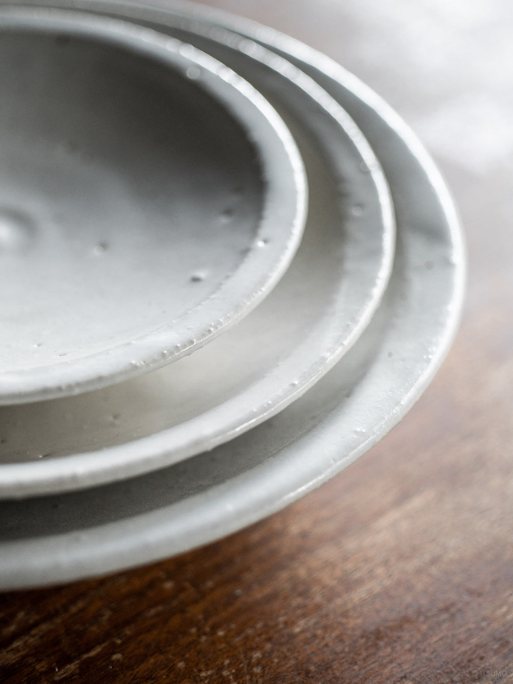 Azmaya iga ware ceramic plates in three sizes: small, medium, and large