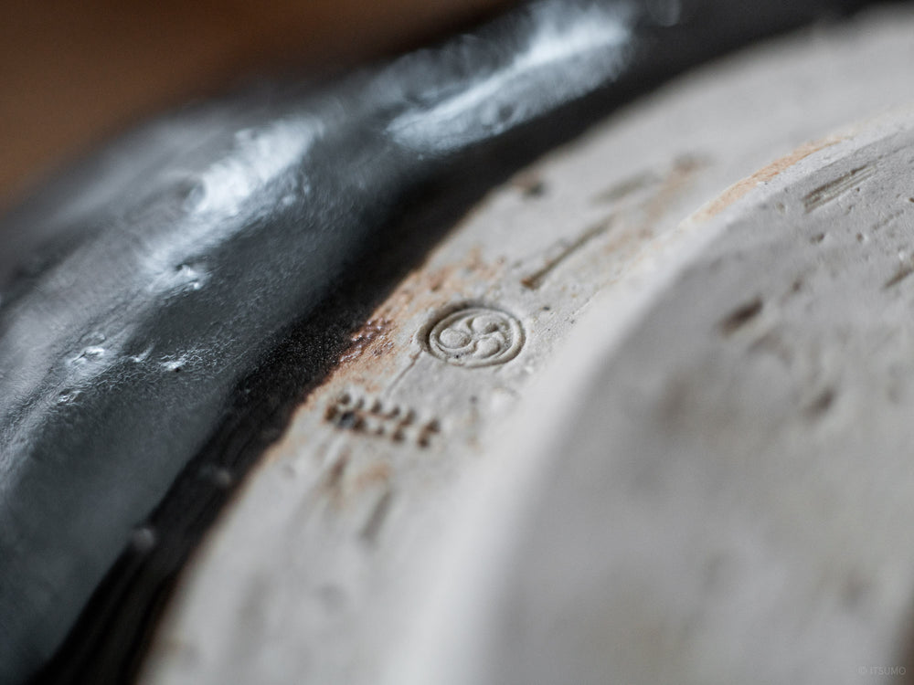 Close up detail of ceramic stamp on Azmaya's iga ware large serving bowl