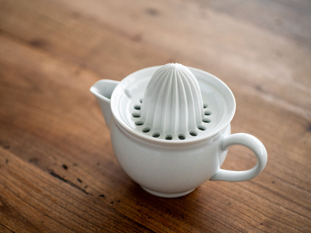 Azmaya white porcelain citrus juicer with a spout and removable top