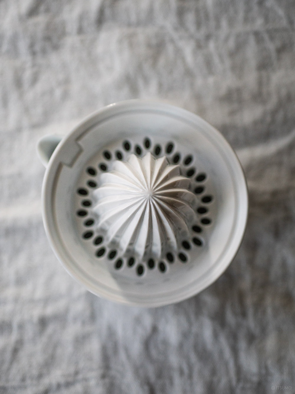 Azmaya large porcelain citrus juicer top with holes to catch orange and grapefruit seeds