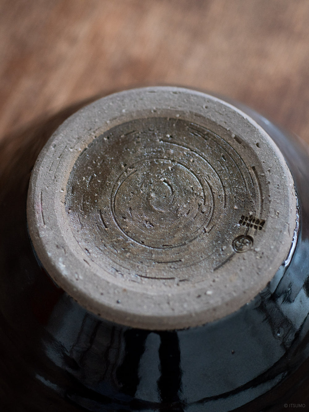 Bottom unglazed base of Azmaya's iga suribachi mortar showing textured ceramic clay