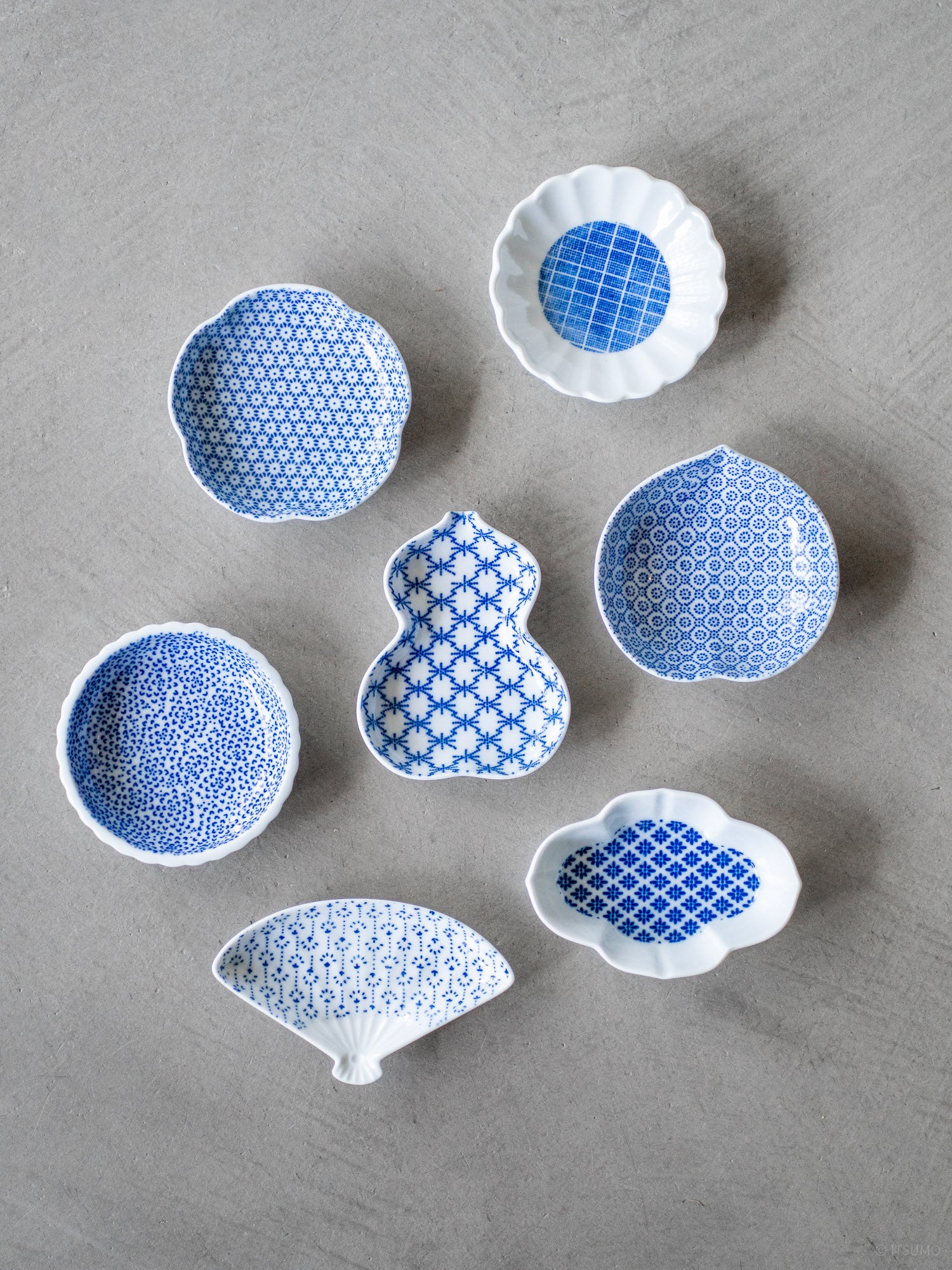 Azmaya small blue porcelain dishes in various shapes and patterns used for serving small things, soy sauce, spices or garnishes