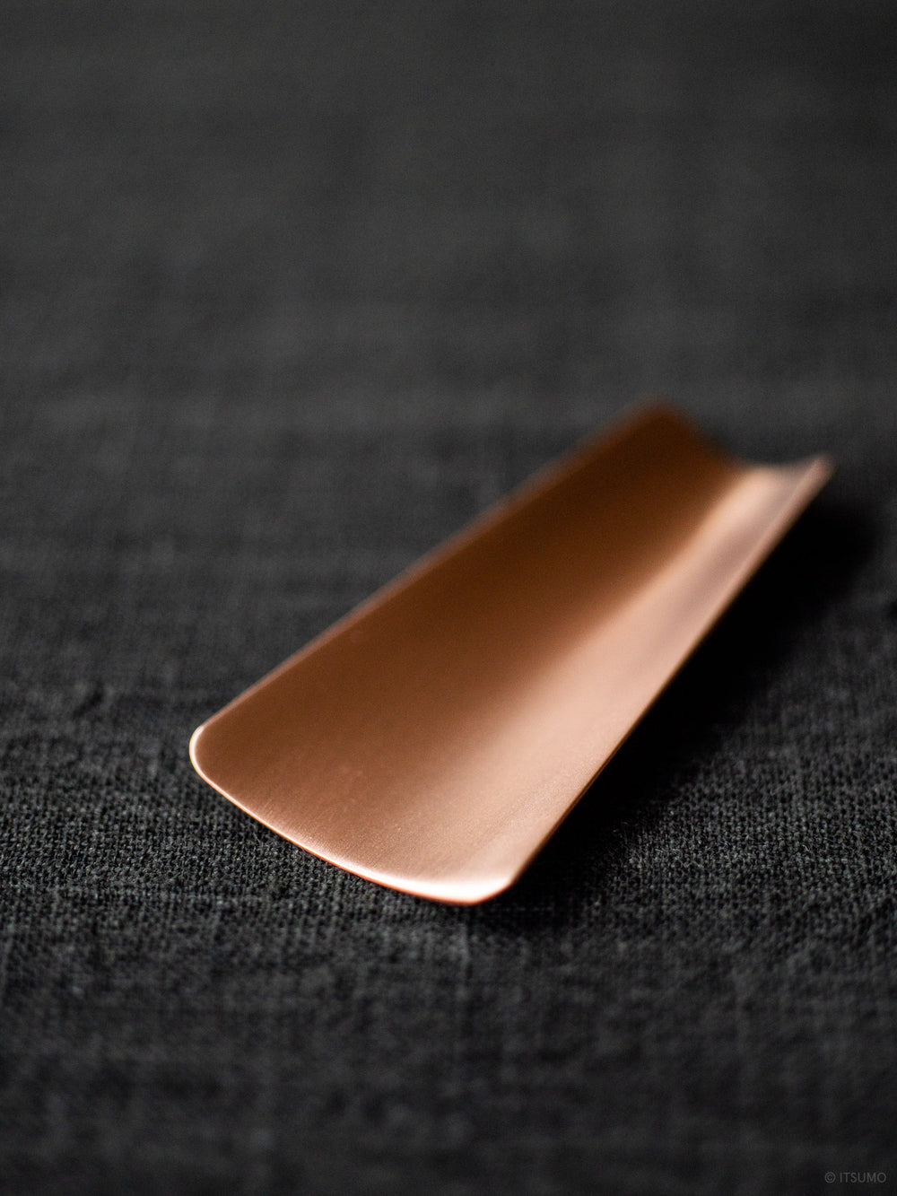 Azmaya copper tea scoop in a flat curved shape