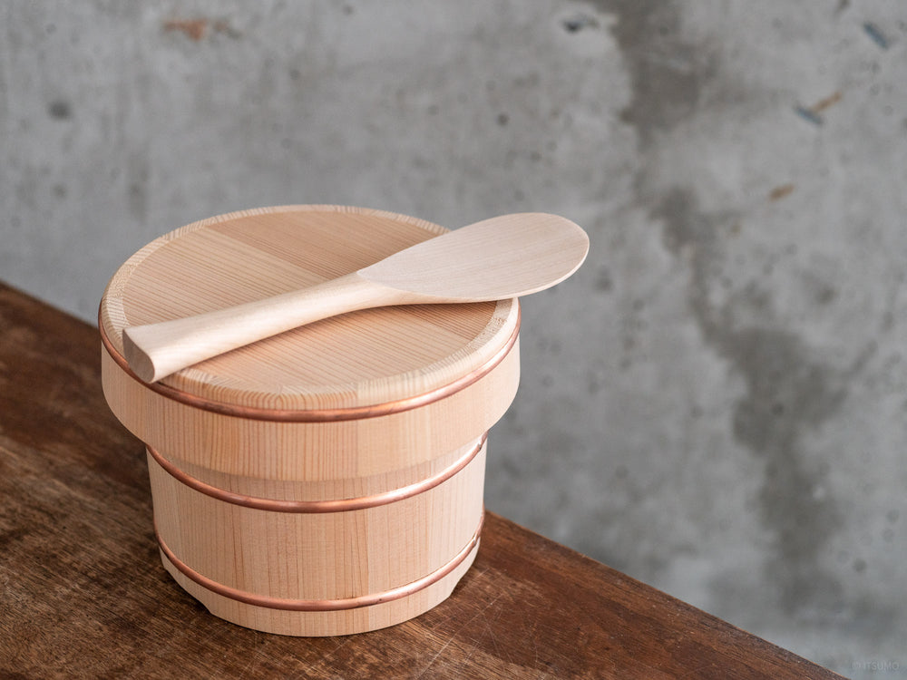 Miyajima rice scoop sitting on top of a kiso sawara ohitsu rice chest