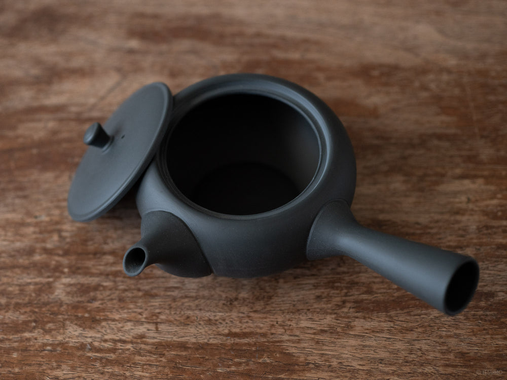 Azmaya ceramic oval teapot in unglazed matte black with side handle and lid