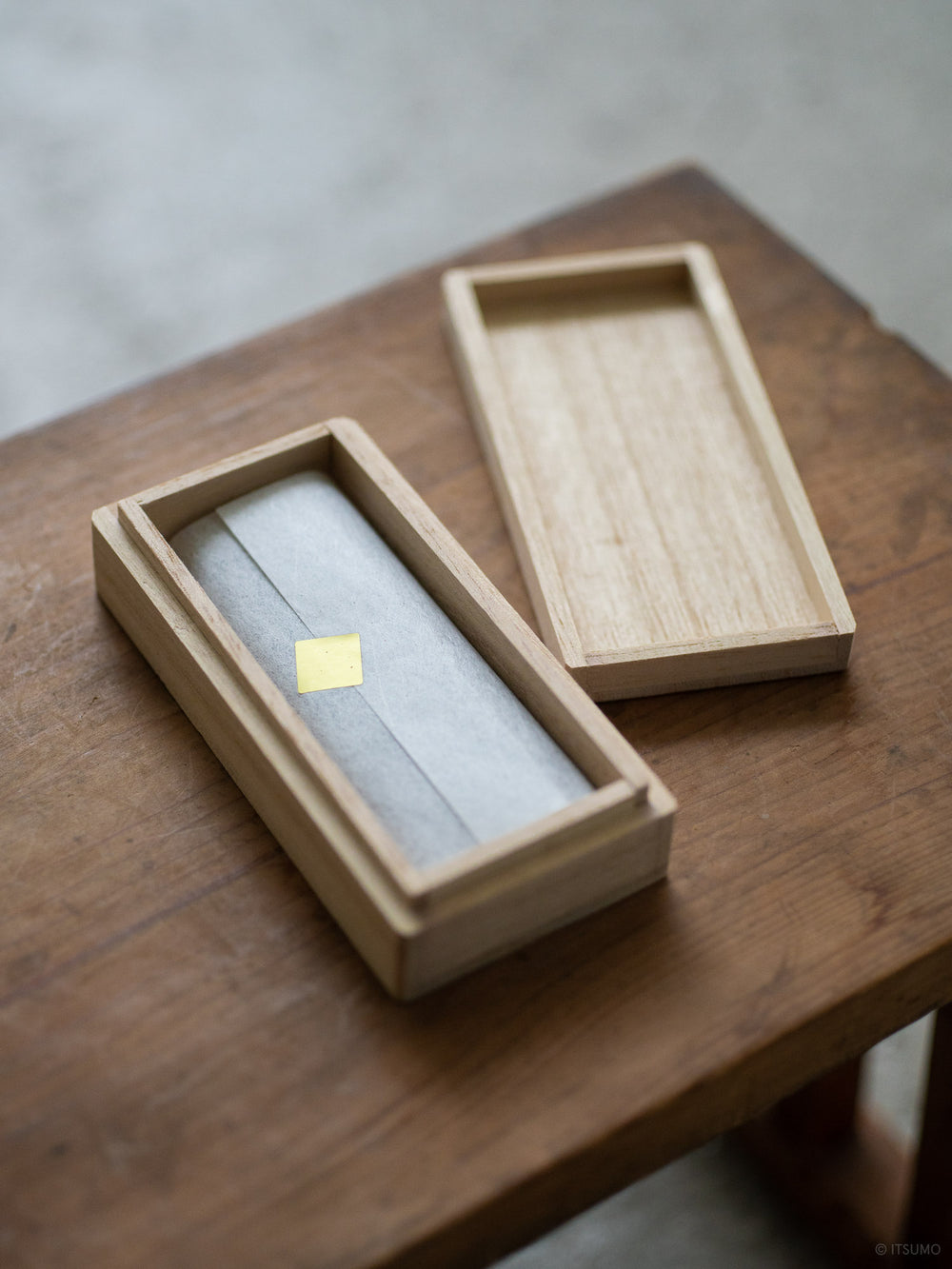 Kousaido magnolia incense wrapped inside an open kiri wood box