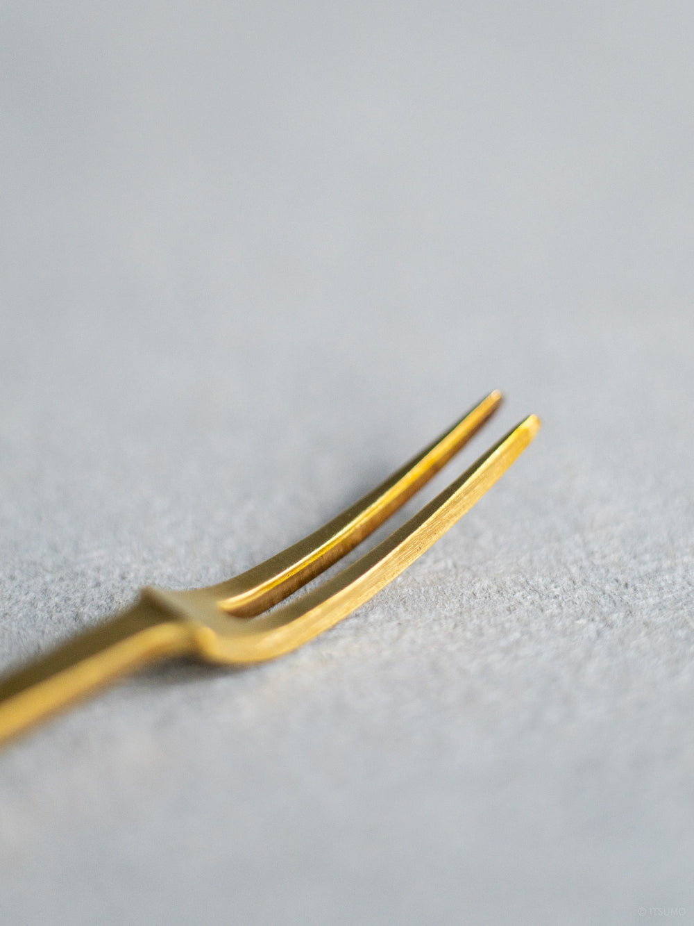 Close up view of the two prong Azmaya brass fork