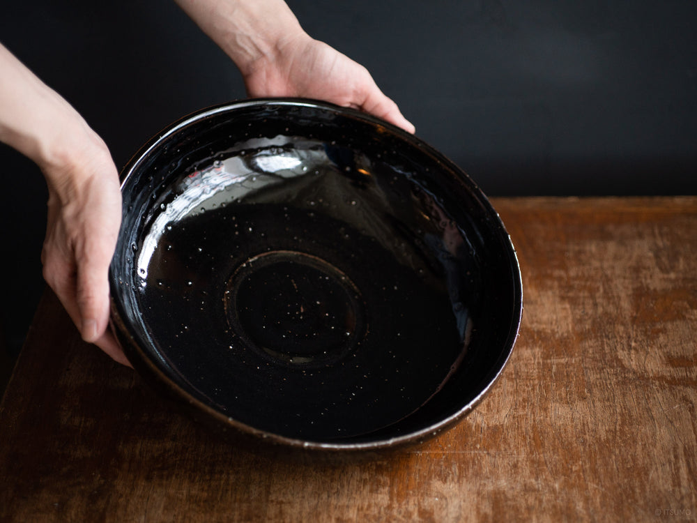 Azmaya's large serving bowl is hand thrown using iga ware techniques in a black kuroame glaze