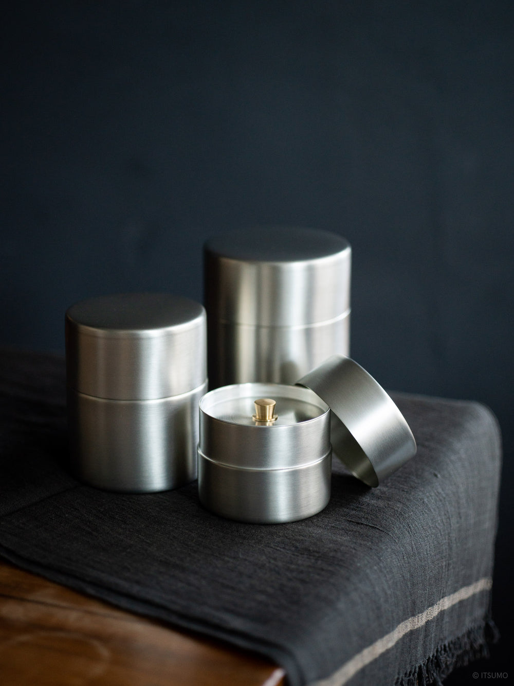 Tin plated copper tea canister open showing the inner lid that protects the tea from moisture