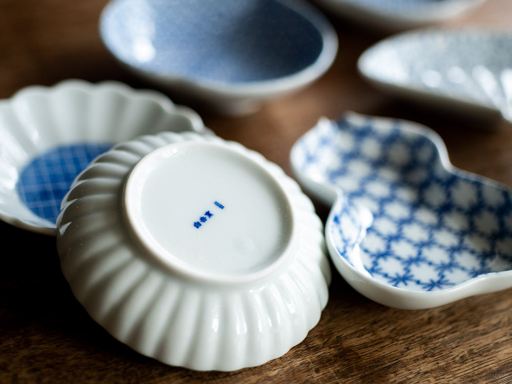 Close up of the bottom of an Azmaya small white porcelain dish