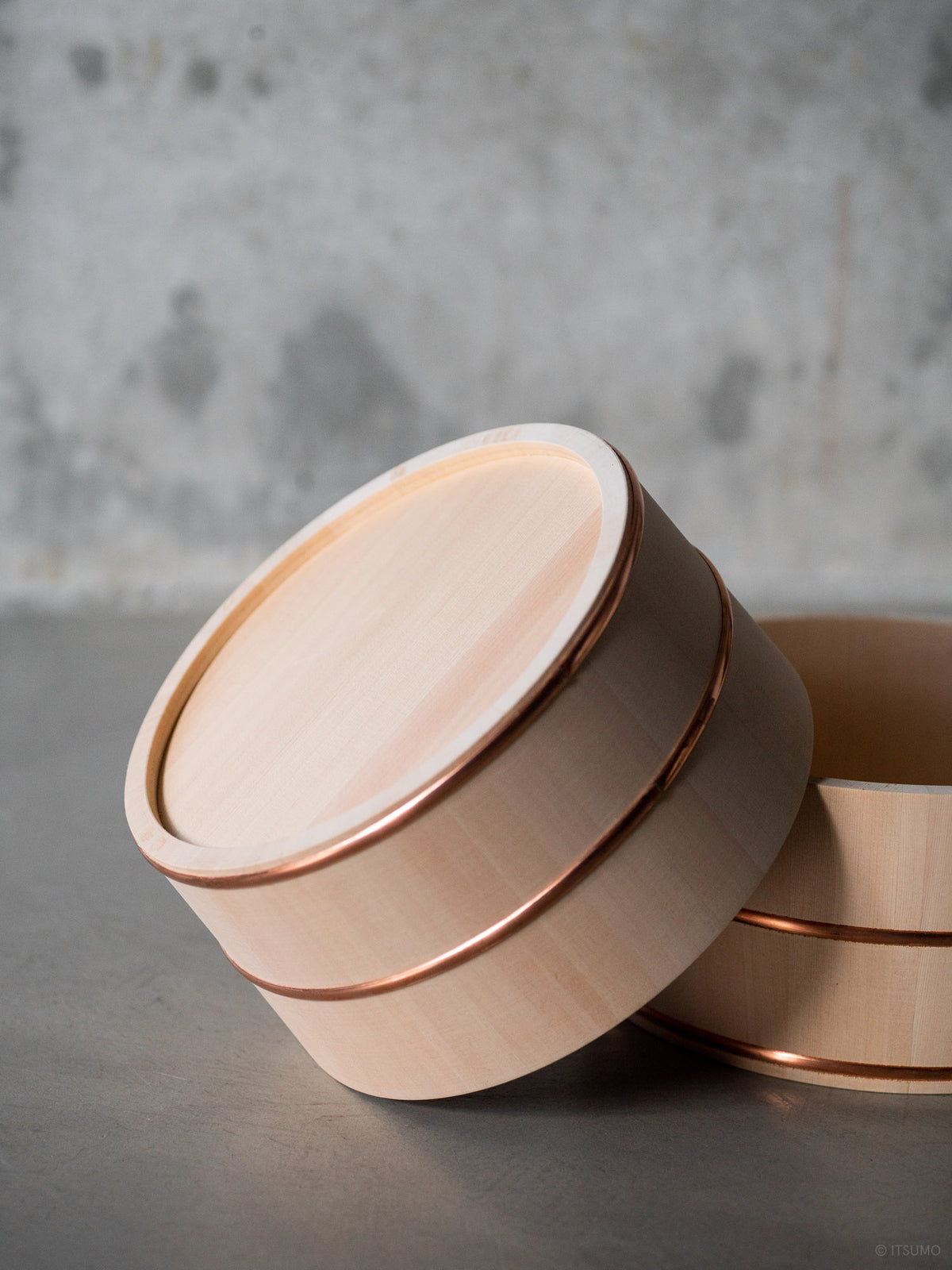Two Japanese hinoki wood bath bowls with copper trim