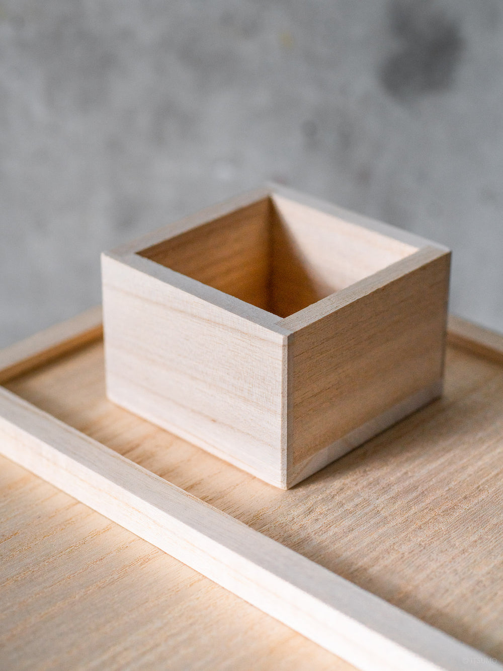 Azmaya rice scoop on top of a Japanese rice storage box