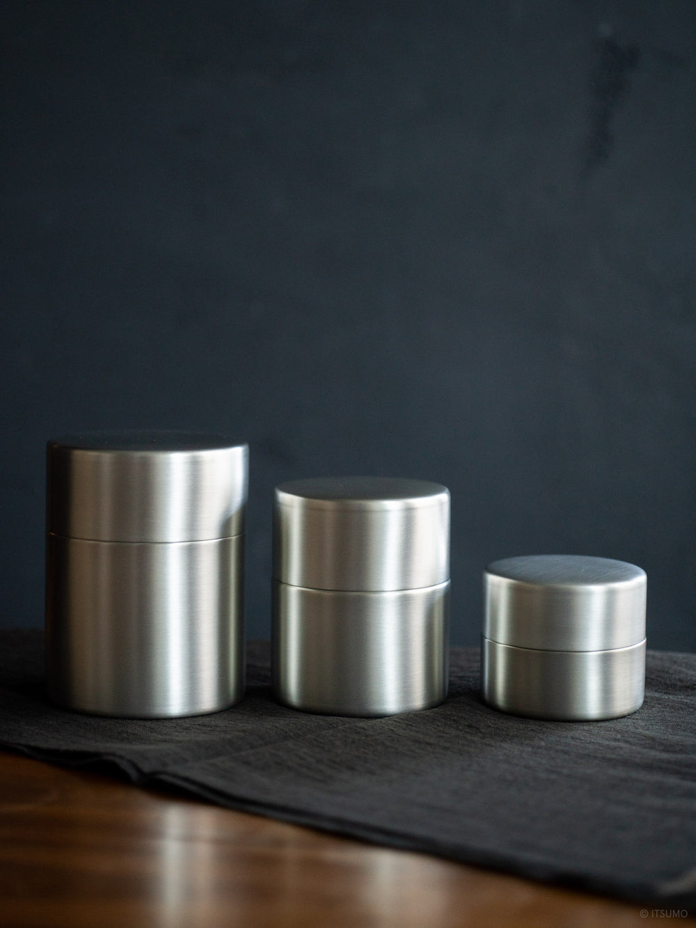 Azmaya tin plated copper tea canisters next to each other in small, medium and large