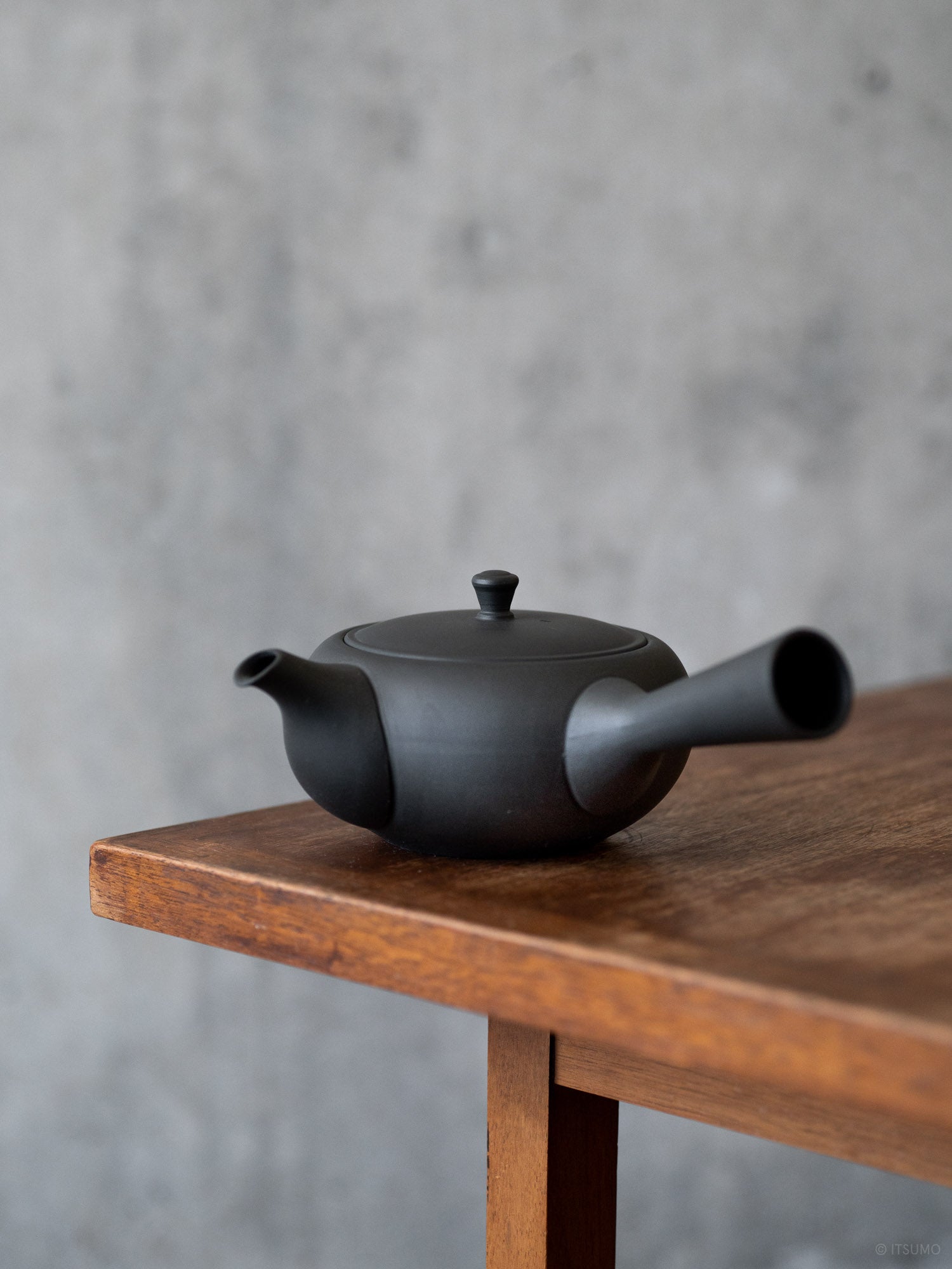 Azmaya ceramic oval teapot in unglazed matte black with side handle