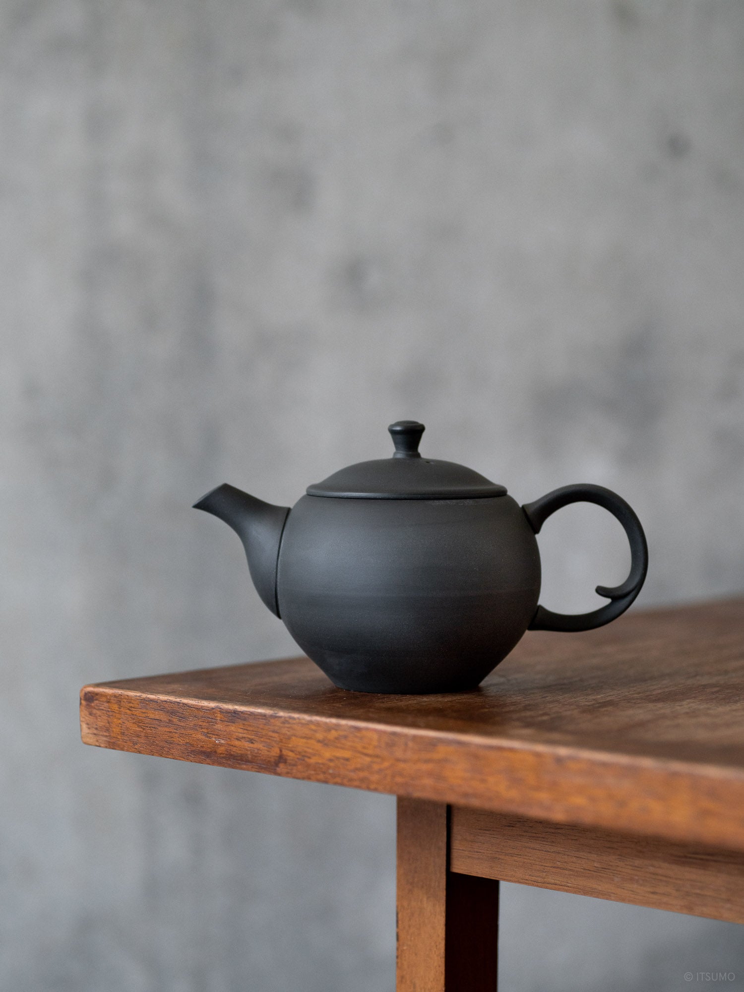 Azmaya round ceramic teapot with back handle in unglazed matte black, 255 ml or 8 oz